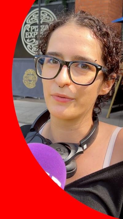 A young person speaking to a purple BBC microphone