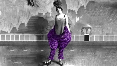 Black and white image of person wearing big purple bloomers