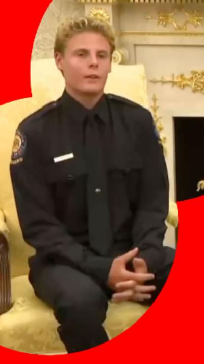 Young man with blonde hair in all black shirt, tie and trousers.