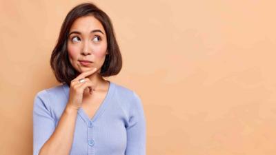 Image of a woman thinking with her hand on her chin