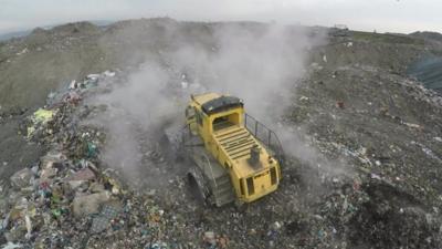 Lorry at rubbish dump