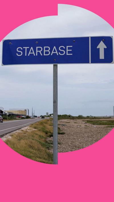 A blue road sign reads 'Starbase', against a backdrop of tower blocks and rocket launchers