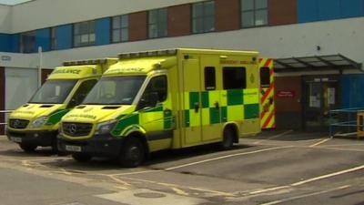 Two ambulances outside a hospital