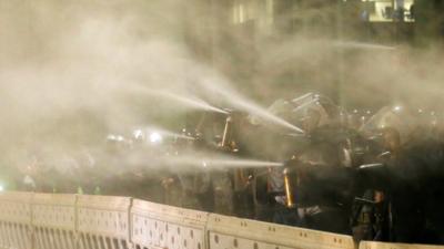 Police officers use pepper spray on demonstrators in Brasilia, Brazil, 11th May 2016.