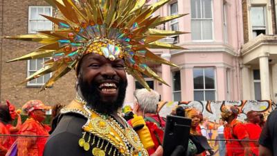 A man in costume smiling