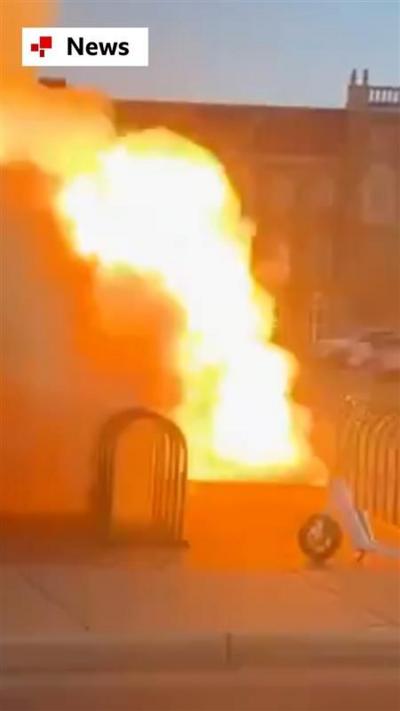 Flames shoot upwards from manhole cover next to a bike rack on Texas college campus