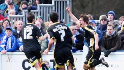 Aaron Ramsey celebrates scoring against Chasetown