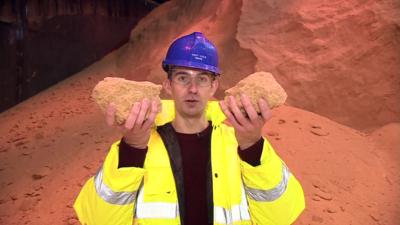 Ben Thompson holding up two massive sugar lumps