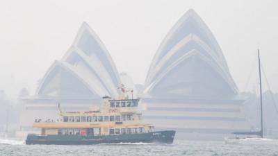 Sydney Opera House seen through smoke