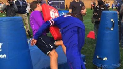 Jan Vertonghen gets tackled by NFL star Ron Brooks