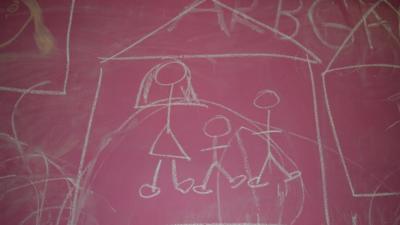 Chalk drawing of a house and family