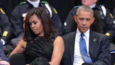 US President Barack Obama and First Lady Michelle Obama attend an interfaith memorial service for the victims of the Dallas police shooting