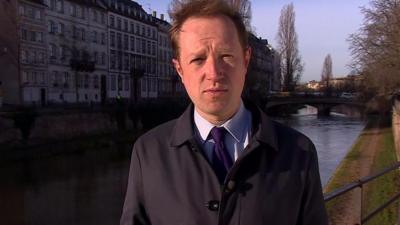 Reporter Adam Fleming by canal in Strasbourg