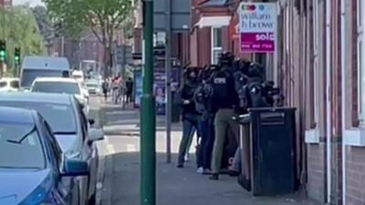 Armed police outside a property in Nottingham