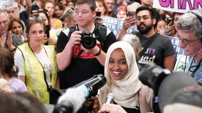 The congresswoman returned to her home state and was met with "welcome home" chants and signs.