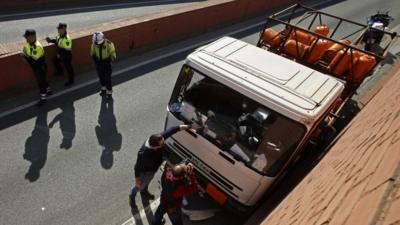 Police in Barcelona inspect a truck