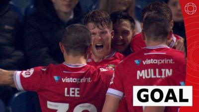 Wrexham midfielder Andy Cannon celebrates his goal against Blackburn with his team-mates