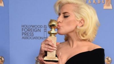 Lady Gaga poses with award for Best Actress TV Series or Limited Movie, for her role in American Horror Story: Hotel