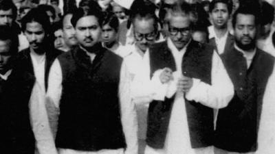 Kamal Hossain and Sheikh Mujib with a large crowd of people