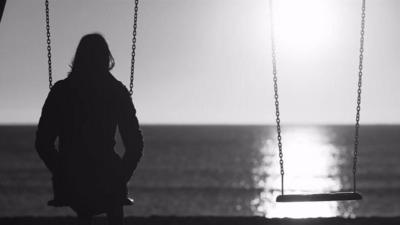 Woman sat on a swing