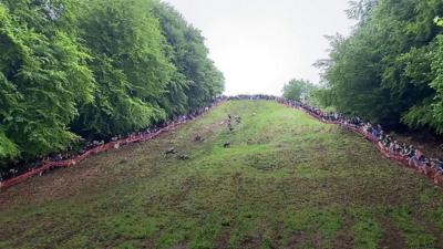 People competing in a cheese rolling competition