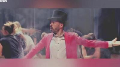 Teacher performing The Greatest Showman