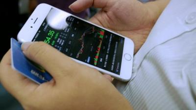 Smartphone displaying stock prices