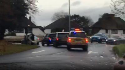 The prime minister's convoy going the wrong way round a roundabout