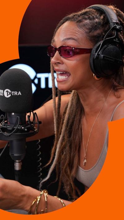 Alesha Dixon at a mic 