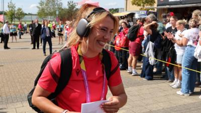 Georgia Evans arrives at the match with a bow in her hair