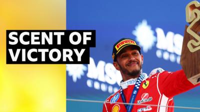 Lewis Hamilton celebrates winning his first GP with Ferrari in Spain