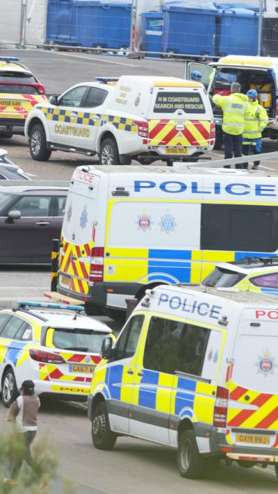 Police vehicles parked near each other. 