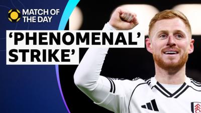 Harrison Reed celebrates with fist in the air in Fulham kit