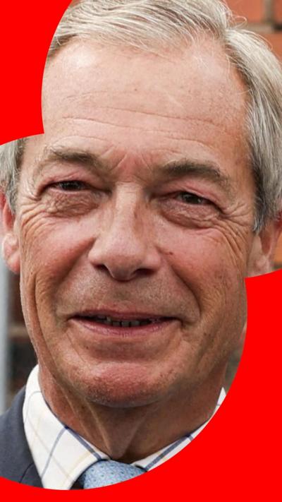 A man with short grey hair smiles at the camera 