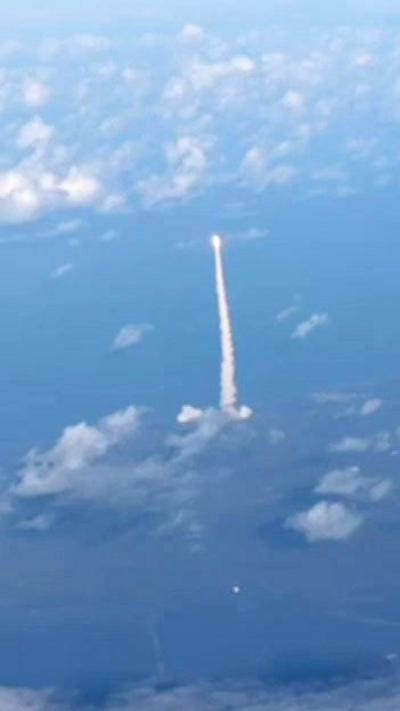 A rocket blasts off.