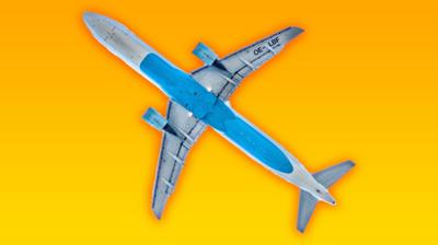 A silhouette of a passenger plane on a yellow background