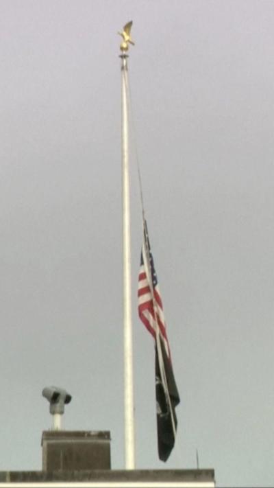 Flag being lowered