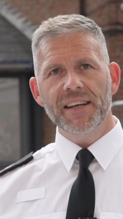 A police officer gives a press conference