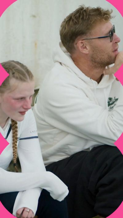A man in sunglasses and a white hoody, Freddie Flintoff, talks to a girl with blonde pigtails