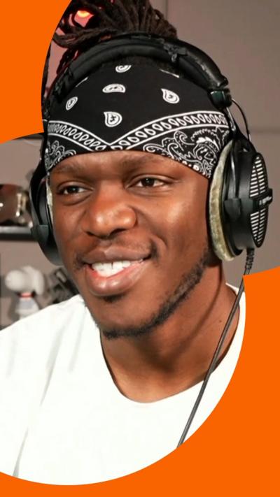 Man with a bandana and headphones on in a white t shirt.