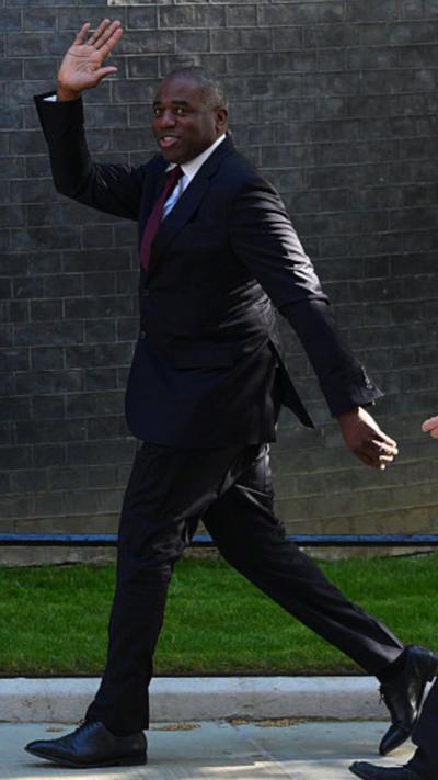 Lammy waves as he walks into No 10