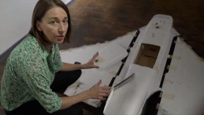 Sarah Rainsford stands next to a Russian Gerbera drone