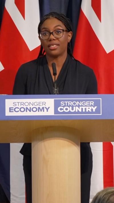 Kemi Badenoch speaks at a lectern 