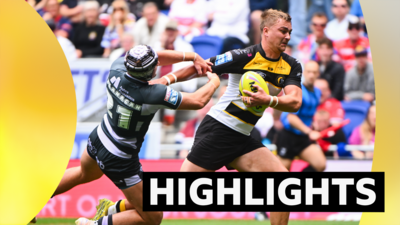 Liam Harris of York is tackled by George Flanagan Jr of Huddersfield