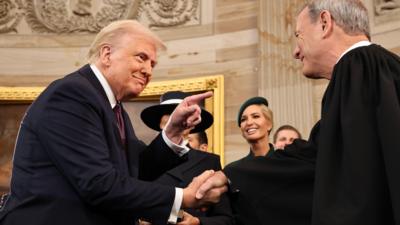 Trump pointing at Supreme Court Chief Justice John Roberts after being sworn in