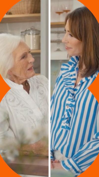 Mary Berry and Alex Jones face each other in a stylised kitchen studio set.
