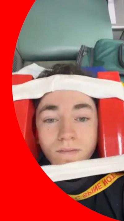 Young man lay in ambulance 