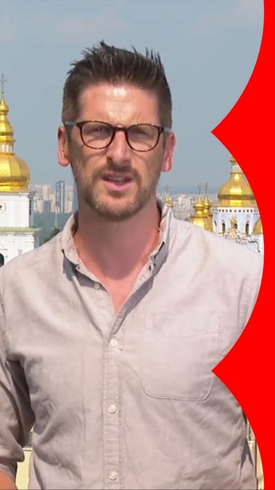 Correspondent Dan Johnson reporting from Ukraine, wears beige shirt