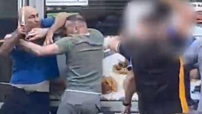 Men fighting outside kebab shop