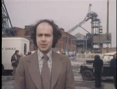 A reporter in front of Golborne colliery.